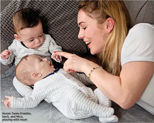  ??  ?? Home: Twins Frankie, back, and Nico, playing with mum