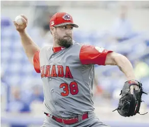  ??  ?? Eric Gagne pitches against the Toronto Blue Jays on Tuesday in Dunedin, Fla. The 41-year-old came out of retirement to play for Team Canada.