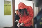  ?? Alexander Zemlianich­enko Associated Press ?? WNBA STAR Brittney Griner, who was arrested in February, leaves a May hearing in Khimki, Russia.