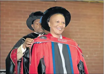  ??  ?? DEBT OF GRATITUDE: Rebosis founder Sisa Ngebulana receives his honorary degree in commerce