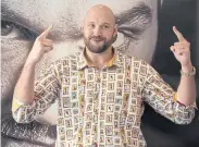  ??  ?? Ex-heavyweigh­t champ Tyson Fury gestures during a press conference.
