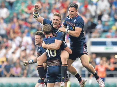  ?? Picture: Getty. ?? Scotland celebrate victory over England in the HSBC London Sevens cup final on Sunday.