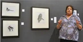  ?? Photos by Matthew Liebenberg ?? ABOVE: Rush Lake artist Marsha Schuld talks about her hand-coloured block prints of Saskatchew­an birds during the Summer Salon public reception, July 27. LEFT: Herbert artist Hedi Gossweiler discusses her fashion designs during the Summer Salon public reception.