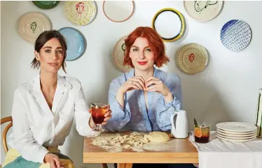  ??  ?? Face-painting: Laura Jackson and Alice Levine with their plate collection for Habitat