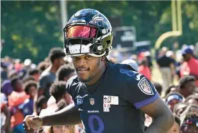  ?? KENNETH K. LAM/BALTIMORE SUN ?? Instead of reports trumpeting the teams that might concoct offers for Ravens quarterbac­k Lamar Jackson, pictured Aug. 16, every news item seemed to reveal another franchise that would not pursue one of the NFL’s most dazzling talents. Soon after, the term “collusion” took center stage.