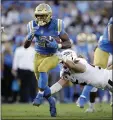  ?? MARCIO JOSE SANCHEZ — ASSOCIATED PRESS ?? UCLA’S Joshua Kelley sprints past Arizona State’s Roe Wilkins in Saturday’s win at the Rose Bowl.