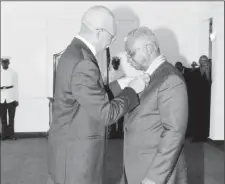  ??  ?? President David Granger conferring Prime Minister of Barbados Freundel Stuart with the Order of Roraima earlier this year