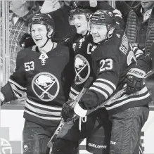  ?? ASSOCIATED PRESS FILE PHOTO ?? From left, Jeff Skinner, Jack Eichel and Sam Reinhart celebrate a goal against Toronto on Dec. 4.