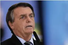  ??  ?? Brazil’s president Jair Bolsonaro remains against lockdowns despite the grim tally
