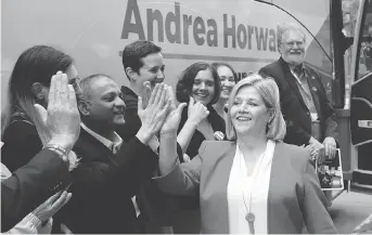  ?? PATRICK DOYLE/THE CANADIAN PRESS ?? Ontario NDP Leader Andrea Horwath greets local candidates at a campaign stop in Ottawa. The surge in her party’s popularity has made an otherwise static region competitiv­e.