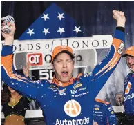  ?? JOHN AMIS/ASSOCIATED PRESS ?? Brad Keselowski celebrates in Victory Lane after winning a NASCAR Monster Cup series auto race at Atlanta Motor Speedway.