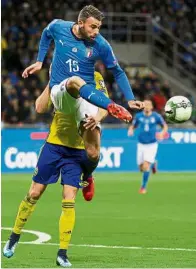  ??  ?? End of the road: Italy’s Andrea Barzagli clearing the ball away from danger in the World Cup playoff secondleg clash against Sweden on Monday. Barzagli also announced his retirement after the match. — Reuters