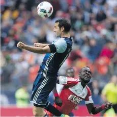  ?? THE CANADIAN PRESS/FILES ?? Vancouver Whitecaps midfielder Andrew Jacobson, seen heading a ball during a game against the New England Revolution, says the team has a poor record but “a lot to build off of” in its pursuit of one of the Western Conference’s final playoff berths.