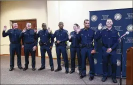  ?? BRUCE R. BENNETT / THE PALM BEACH POST ?? Seven new Boynton Beach police officers were sworn in during a program Tuesday, giving the city a force of 156.