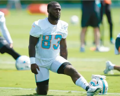  ?? LYNNE SLADKY/AP ?? Miami wide receiver DeVonte Dedmon, a former Warhill High and William & Mary standout, takes part in drills June 1 at the Dolphins’ practice facility in South Florida.