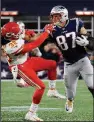  ?? AP/STEVEN SENNE ?? New England tight end Rob Gronkowski (87) gives a stiff arm to Kansas City free safety Ron Parker after catching a pass during the Patriots’ victory over the Chiefs earlier this season. Coach Bill Belichick said there is little to take away from the Week 6 victory, and Patriots’ players have said they’re in for a tough test today in the AFC Championsh­ip Game.