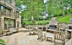  ??  ?? Patio with an outdoor fireplace is a favorite family space.