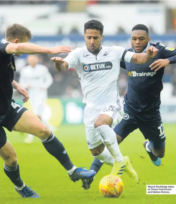  ??  ?? Wayne Routledge takes on Shaun Hutchinson and Mahlon Romeo.