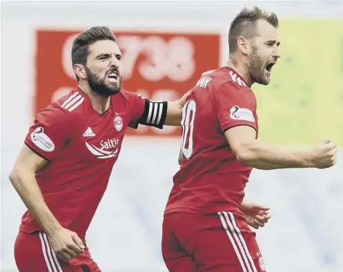  ?? PICTURE: CRAIG FOY/SNS ?? 0 Graeme Shinnie, left, celebrates with goalscorer Niall Mcginn after telling him the free-kick was ‘for a left-footer’.
