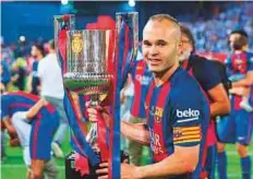  ?? Rex Features ?? ■ Barcelona’s Andres Iniesta with the trophy after winning the Copa del Rey on Saturday.