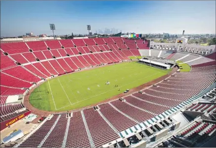  ?? Brian van der Brug Los Angeles Times ?? USC OFFICIALS unveiled the $315-million renovation of the Coliseum on Thursday. Fans can expect to see wider concourses, additional concession stands, improved footing on stairs and a cupholder at every seat. Capacity was reduced from 92,348 to 77,500.