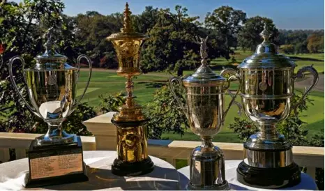  ?? DAVID L. RYAN/GLOBE STAFF ?? The championsh­ip trophies for (from left) the US Girls Junior (2030), US Amateur (2034), US Open (2038), and US Women’s Open (2045) are coming to The Country Club over a span of 15 years.