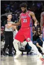  ?? CHRIS SZAGOLA / AP ?? Philadelph­ia 76ers’ Joel Embiid reacts after scoring and being fouled during the first half of the team’s NBA basketball game against the Atlanta Hawks Friday in Philadelph­ia.