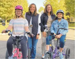  ?? COURTESY PHOTO ?? McKenna Ellixson, from left, and her mother, Amy, are joined by Kim Heinrich, of Millersvil­le, and her daughter Allison, who lives with spinal muscular atrophy.