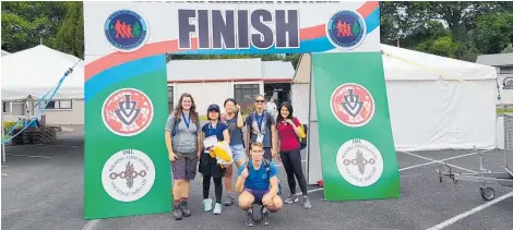  ?? Photos / Supplied ?? Locals and internatio­nal visitors share a moment at the finish line during the Rotorua Walking Festival.