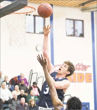  ?? Krista Benson / For Hearst Connecticu­t Media ?? Wilton’s Ryan Biberon, above, shooting against Danbury in a Feb. 11 game, was one of many state players to take part in the inaugural NCAA College Basketball Academy on Tuesday at UConn in Storrs.