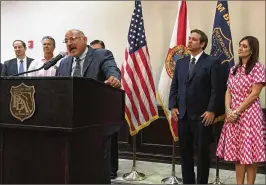  ?? GEORGE BENNETT / THE PALM BEACH POST ?? Florida Police Benevolent Associatio­n President John Kazanjian, at podium, announces the union’s endorsemen­t of Republican Ron DeSantis.