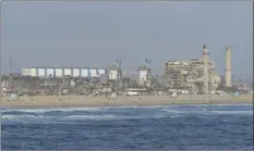  ?? AP photo ?? The AES Huntington Beach Energy Center in Huntington Beach, Calif., is shown on May 2. A California coastal panel on Wednesday rejected a long-standing proposal to build a $1.4 billion seawater desalinati­on plant to turn Pacific Ocean water into drinking water as the state grapples with persistent drought