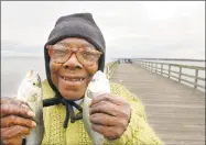  ?? Hearst Connecticu­t Media file photo ?? Estelle Dixon of New Haven, 73, holds two snapper bluefish that she caught on the Fort Hale Park State Fishing Pier in New Haven in Oct. 2006.