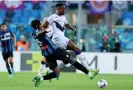  ?? Magni/EPA ?? Caleb Okoli slides in to tackle Fiorentina’s Christian Kouamé. Photograph: Paolo
