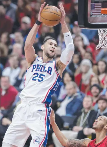  ?? Picture: CRAIG MITCHELLDY­ER/AP ?? NOT ENOUGH: Ben Simmons shoots over Portland Trail Blazers guard Shabazz Napier during the first half of their NBA match in Portland, Oregon.