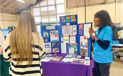  ?? Angela Guglielmin­o/appeal-democrat ?? Annette Goodly speaks with students at the Department of Air Force School Liaisons table during the first Tri-county ROP Career Fair held on Thursday at the Yuba-sutter Fairground­s in Yuba City.