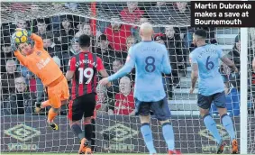  ??  ?? Martin Dubravka makes a save at Bournemout­h