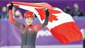  ?? THE CANADIAN PRESS/PAUL CHIASSON ?? Kim Boutin, of Canada, celebrates after winning silver in the women’s 1,000-metre short-track speedskati­ng at the 2018 Olympic Winter Games, in Gangneung, South Korea, Thursday.
