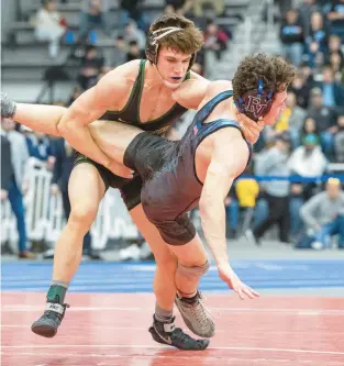  ?? MIKE CAUDILL/FREELANCE ?? Great Bridge’s Eric Doran, left, shown taking down Eastern View’s Cam Sheads during the Class 4 state championsh­ip last season, won the 150-pound weight class at the Ocean Lakes Invitation­al last weekend.