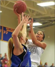  ?? PETE BANNAN — DIGITAL FIRST MEDIA ?? West Chester Henderson’s Adrienne Smith (23) shoots against Spring Grove Saturday afternoon at Downingtwn West.