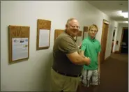  ?? SUBMITTED PHOTOS ?? Jonah Magid is shown with Pastor Arlie Spargur, left, of Lakeside Baptist Church in Painesvill­e Township. For his Eagle Scout project, Magid designed wooden plaques to highlight the church’s missions trips.