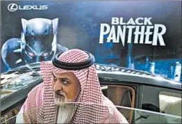  ?? AMR NABIL/AP ?? A visitor checks out a Lexus car, similar to one used in the “Black Panther” film, on display Wednesday outside an invitation-only screening in Riyadh, Saudi Arabia.