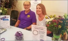  ?? BILL RETTEW JR. – DIGITAL FIRST MEDIA ?? John Gailey III, left, and Alison Slickers remember those taken by addiction during Thursday’s “Building Community, Sharing Hope” event at the Melton Community Center.