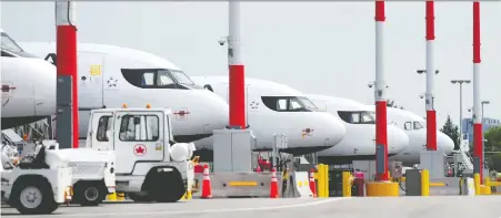  ?? NICK PROCAYLO ?? Grounded Air Canada jets are lined up at the Vancouver Internatio­nal Airport on May 11. Vancity CEO Tamara Vrooman will be leaving that role to become president and CEO of the airport authority starting July 1. The authority recently issued layoff notices to a quarter of its workforce.