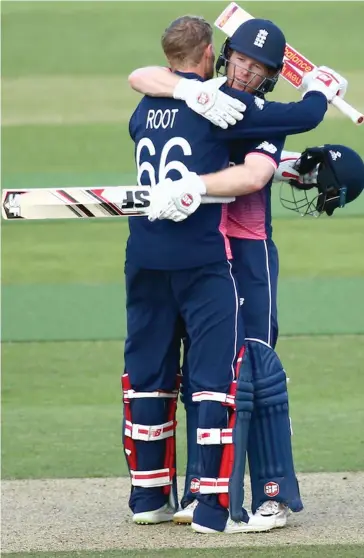  ?? Photo: Zimbio ?? Joe Root and Eoin Morgan of England embrace after victory in the ICC Champions Trophy match against Bangladesh at The Kia Oval on June 2, 2017 in London, England.