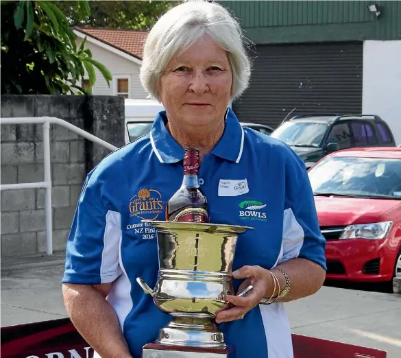  ??  ?? Mary McNabb, with the Corner to Corner Trophy, the first bowls tournament she has ever won.