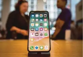  ?? BLOOMBERG PIC ?? Apple has been counting on the iPhone X to boost shipments but demand has been lacklustre during the holiday shopping season.