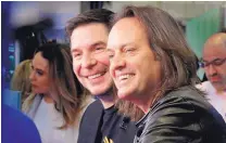  ?? RICHARD DREW/ASSOCIATED PRESS ?? Sprint CEO Marcelo Claure, left, and T-Mobile CEO John Legere are interviewe­d about the planned merger of their companies on the floor of the New York Stock Exchange on Monday.