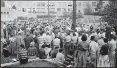  ?? Associated Press ?? Students, reporters and onlookers watch as Arkansas National Guard troops are dispatched by Gov. Orval Faubus to prevent nine black students from entering Little Rock Central High School on Sept. 9, 1957.