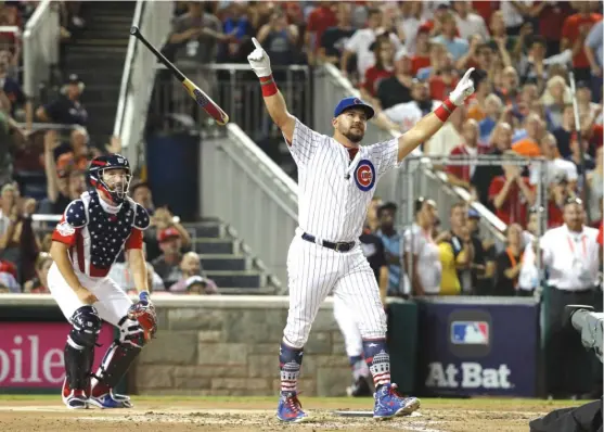  ?? GETTY IMAGES ?? The Cubs’ Kyle Schwarber (above) celebrates after defeating the Phillies’ Rhys Hoskins 21-20 in the semifinals of the Home Run Derby on Monday in Washington. The Nationals’ Bryce Harper (left) rejoices after edging Schwarber 19-18 in the final.